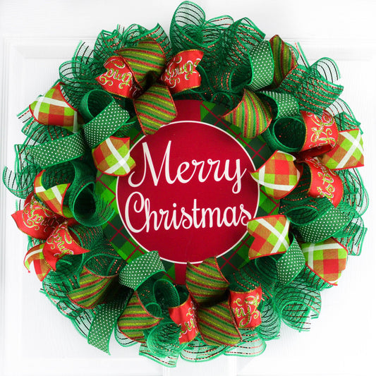 Red and Green Merry Christmas wreath on a white door