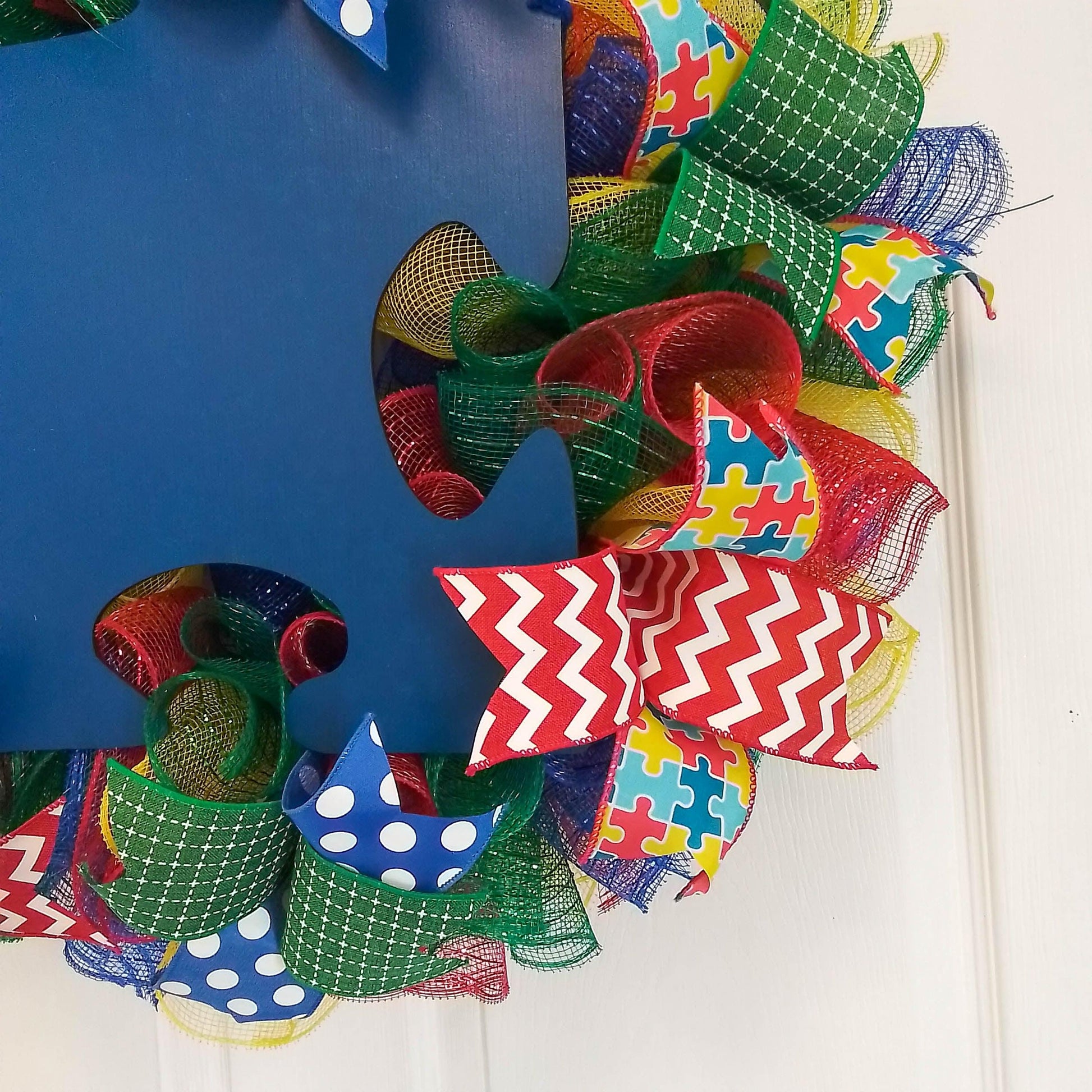 Autism Awareness Door Wreath puzzle piece; blue red yellow emerald - Pink Door Wreaths