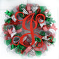 red and silver and emerald green Christmas wreath with red monogram J in the center