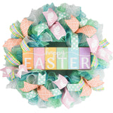 Happy easter mint and turquoise wreath with wooden sign in center
