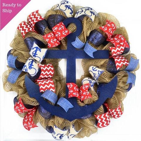 Jute mesh wreath with red, navy and white ribbons and a navy blue anchor in the center