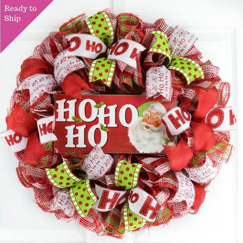 Ready to Ship Red White and Lime Green Mesh Wreath with a wooden Ho Ho Ho sign with a Santa Face on the sign, all hanging on a white door