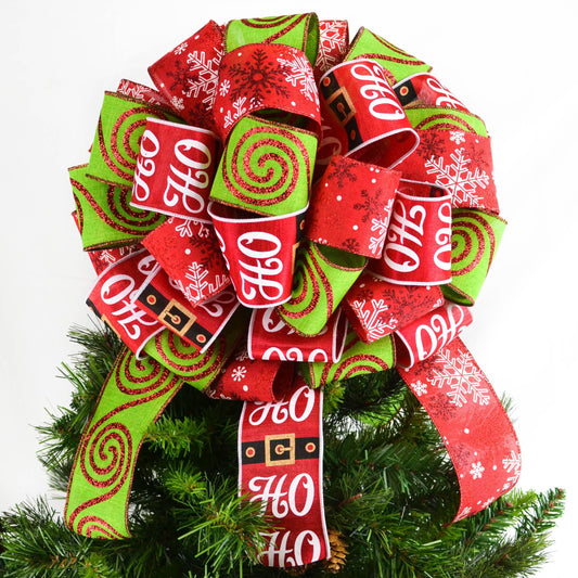 Christmas Tree Bow with red and lime ribbons, one with Santa print, on top of a Christmas tree