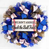 Royal Blue and Burlap wreath with baseball ribbons around the baseball sign